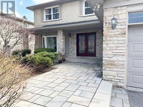 Toronto (Banbury-Don Mills) apartment for rent - A house with a stone wall and a red door.