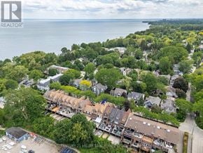 Oakville (Co Central) townhouse for rent - An aerial view of a residential area with a body of water in the background.