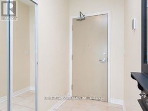 Toronto (Willowdale East) condo for rent - A room with a door and a mirror on the wall.