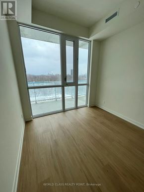 Toronto (Parkwoods-Donalda) condo for rent - A room with a view of a snowy landscape through a large window.