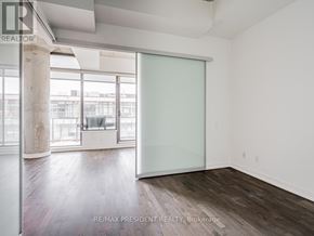 Toronto (Waterfront Communities) condo for rent - A room with a glass door and a wooden floor.