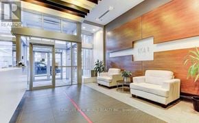 Toronto (Bendale) condo for rent - A lobby with a glass door and a sign that says "BOLT".
