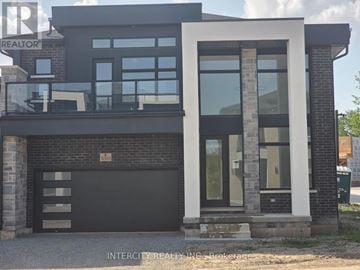 Niagara Falls (Marineland) apartment for rent - A modern house with a black garage door and a glass door.