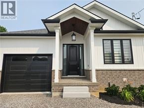 Hamilton apartment for rent - A house with a black front door and a white garage door.