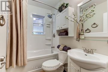 Toronto (Willowdale West) apartment for rent - A kitchen with white cabinets and a window above the sink.