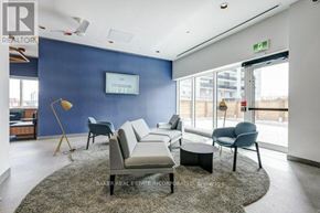 Toronto (St. Andrew-Windfields) townhouse for rent - A living room with a grey rug and a white sofa.