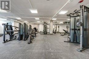 Toronto (St. Andrew-Windfields) townhouse for rent - A gym with a variety of equipment including treadmills, weights, and exercise machines.