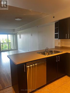 Burlington (Alton) condo for rent - A kitchen with a sink and a dishwasher.