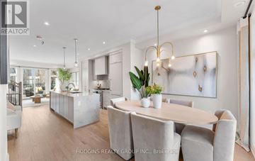 Mississauga (Mineola) townhouse for rent - A modern dining room with a large table and chairs.
