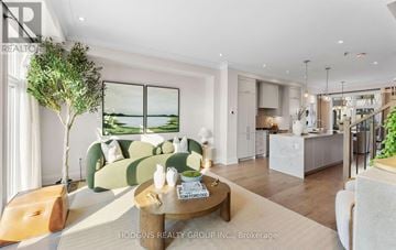 Mississauga (Mineola) townhouse for rent - A modern living room with a green sofa and a coffee table.