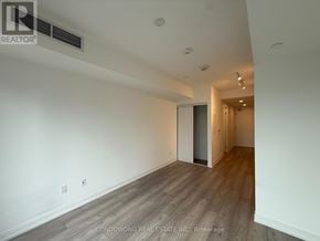 Toronto (Church-Yonge Corridor) condo for rent - A cityscape with a mix of modern and older buildings.