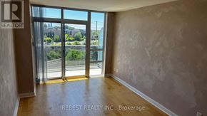 Toronto (Islington-City Centre West) condo for rent - A room with a view of the street through the window.