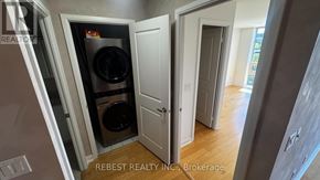 Toronto (Islington-City Centre West) condo for rent - A white door is open to a hallway.