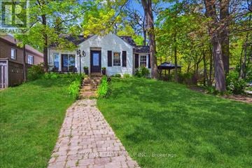 Mississauga (Mineola) multi-family for rent - A house with a brick pathway leading to the front door.