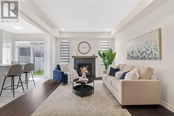 Ottawa apartment for rent - A living room with a fireplace and a large painting on the wall.