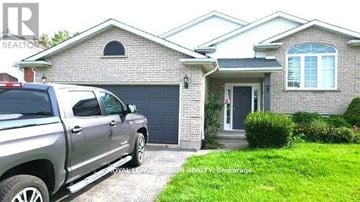 Niagara Falls (Ascot) apartment for rent - A grey pickup truck is parked in front of a brick house.