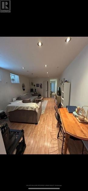 Toronto (University) triplex for rent - A room with a bed, a table, and a chair.