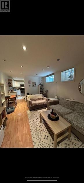 Toronto (University) triplex for rent - A living room with a couch, a coffee table, and a rug.