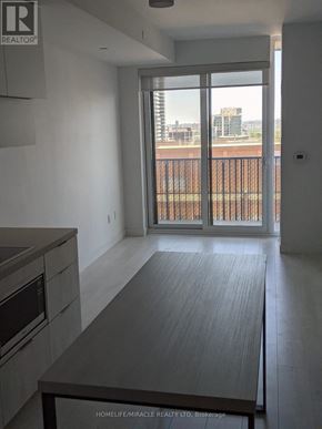 Toronto (Yonge-Eglinton) condo for rent - A modern kitchen with a view of the city.