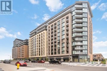 Vaughan condo for rent - A modern multi-story building with a glass facade is the main focus of the image.