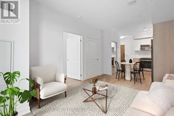 Vaughan condo for rent - A living room with a white couch and a coffee table.
