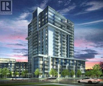 Toronto (Henry Farm) condo for rent - A modern multi-story building with a glass facade is depicted in the image.