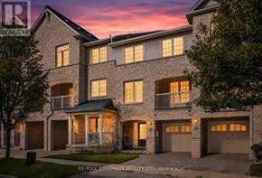 Ajax (Central East) townhouse for rent - A large, well-lit house with multiple windows and garages is shown.