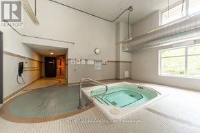 Toronto (Bendale) condo for rent - A large indoor swimming pool with a walk-in spa area.