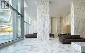 Mississauga (City Centre) condo for rent - A spacious lobby with marble floors and columns.