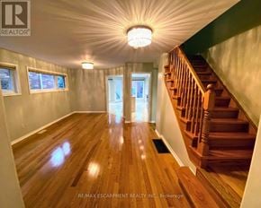 Mississauga (Lisgar) apartment for rent - A wooden staircase with a light on the ceiling.