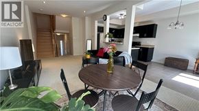 Grimsby townhouse for rent - A dining room with a table set for two.