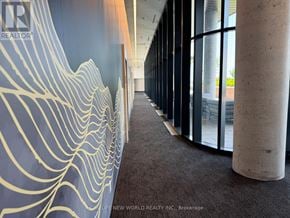 Markham (Unionville) condo for rent - A hallway with a blue wall and a white line design.