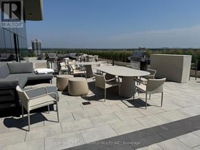 Markham (Unionville) condo for rent - A patio area with furniture and a sign that says REALTOR.