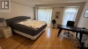 Toronto (Newtonbrook West) townhouse for rent - A bedroom with a bed, desk, and chair.