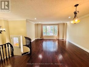 Markham (Milliken Mills West) apartment for rent - A room with wooden floors and a window with curtains.