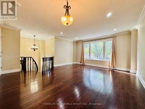 Markham (Milliken Mills West) apartment for rent - A bathroom with a toilet, sink, and mirror.