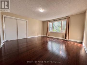 Markham (Milliken Mills West) apartment for rent - A bedroom with a bed, window, and wooden floors.