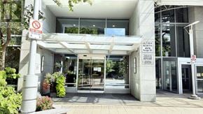 Toronto (Lansing-Westgate) condo for rent - The entrance to a building with a no parking sign on the left.