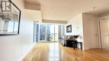 Toronto (Lansing-Westgate) condo for rent - A living room with a couch and a coffee table.