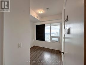 Toronto (Mount Pleasant West) condo for rent - A white room with a window and a wooden floor.