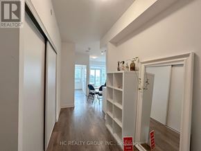 Toronto (Mount Pleasant West) condo for rent - A realtor photo of a room with a long hallway and a table with chairs.