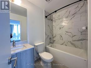 Toronto (Henry Farm) condo for rent - A bathroom with a marble tile shower and toilet.