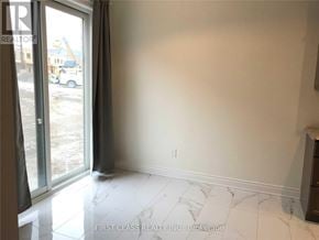 Richmond Hill apartment for rent - A room with a marble floor and a sliding glass door.
