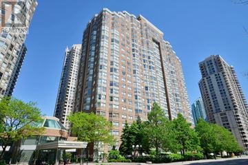 Mississauga (City Centre) condo for rent - A tall residential building with a lot of windows and balconies.