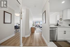 Mississauga (City Centre) condo for rent - A hallway with a wooden floor and white walls.