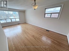 Toronto (Clairlea-Birchmount) apartment for rent - A room with wooden flooring and a window.