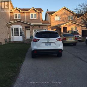 Mississauga (East Credit) townhouse for rent - A white car is parked in front of a house with the license plate BRY-500.