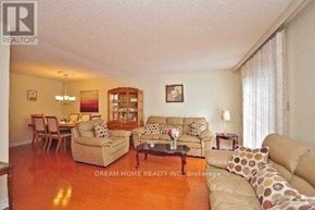 Mississauga (East Credit) townhouse for rent - A living room with a couch, chairs, and a coffee table.