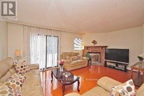 Mississauga (East Credit) townhouse for rent - A living room with a couch, a coffee table, and a television.