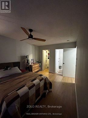 Hamilton (Ainslie Wood) condo for rent - A bedroom with a bed, dresser, and ceiling fan.